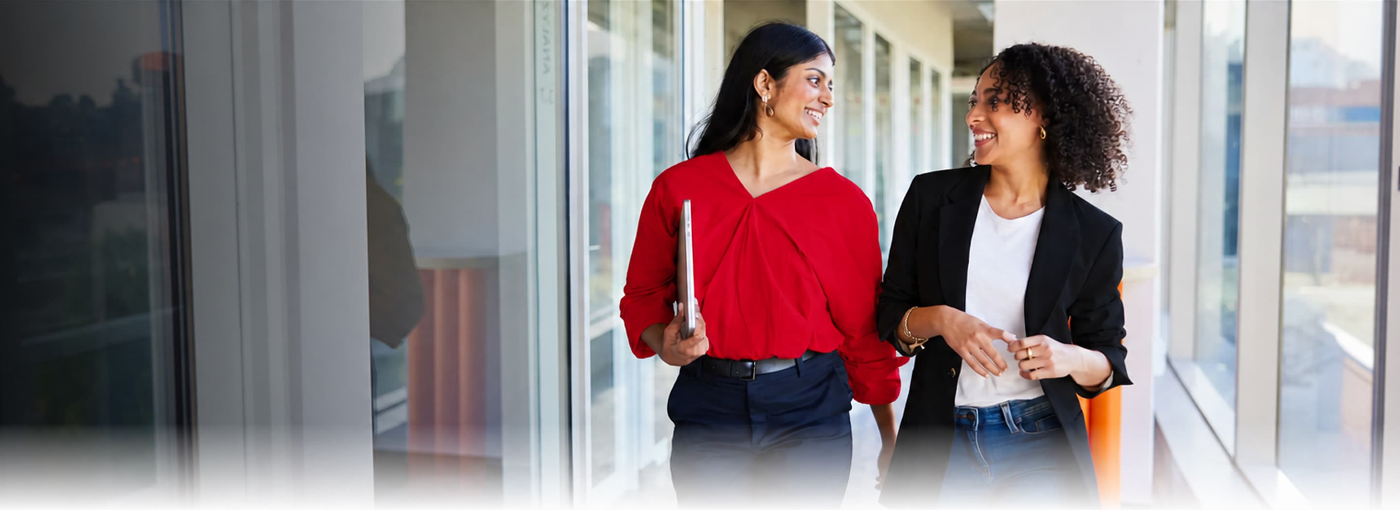 Mahindra team members walking together in an office