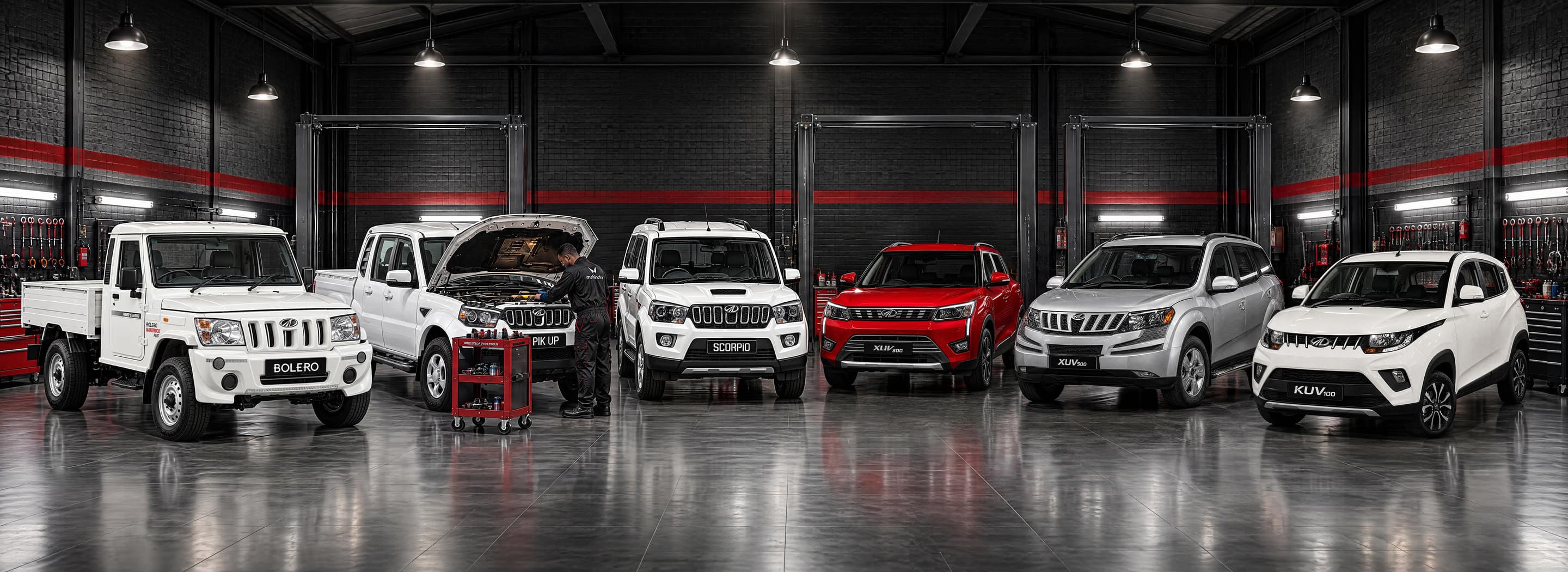 Mahindra Bolero, Pik Up, Scorpio, XUV and KUV models in a service workshop