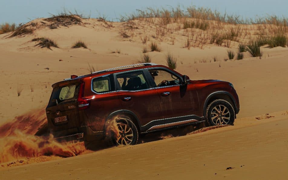Mahindra Scorpio-N kicking up sand on a dune
